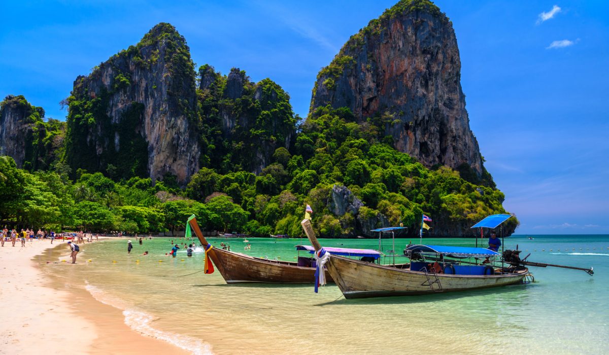 Long tail boats and rocks on Railay beach west, Ao Nang, Krabi, Thailand