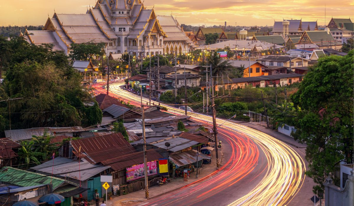 wat sothonwararam with light from a car and sunset background in cha choeng sao old city, Thailand